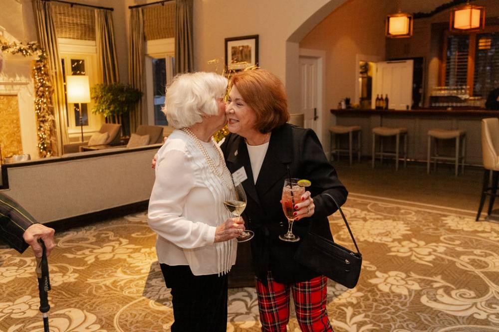 Sue Jandernoa greeting other reception guest